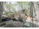 A backyard featuring a wooden deck, a playhouse, and a grill, perfect for outdoor entertaining and relaxation at 4520 Jackybell Trl, Decatur, GA 30034