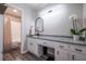Updated bathroom with white vanity, granite countertops, and a tub with shower at 4520 Jackybell Trl, Decatur, GA 30034