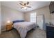 Bright bedroom with a large bed, wood floors, and natural light from the window at 4520 Jackybell Trl, Decatur, GA 30034