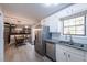 Bright kitchen with granite countertops, stainless steel appliances, and stylish finishes at 4520 Jackybell Trl, Decatur, GA 30034