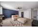 Bright living room showcases a sectional sofa, dark blue accent wall, and stylish rug at 4520 Jackybell Trl, Decatur, GA 30034