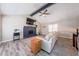 Cozy living room with vaulted ceilings, a stone fireplace, and ample natural light at 4520 Jackybell Trl, Decatur, GA 30034