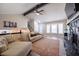Spacious living room featuring a stone fireplace and an open layout to the kitchen at 4520 Jackybell Trl, Decatur, GA 30034