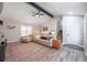 Bright living room with vaulted ceilings, modern flooring, and a staircase at 4520 Jackybell Trl, Decatur, GA 30034