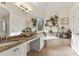 Bright bathroom features a dual sink vanity, soaking tub, and natural light, ideal for a relaxing experience at 4829 Thicket Nw Path, Acworth, GA 30102