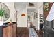 Inviting home foyer featuring hardwood floors, a staircase, and an entry table with decorative items at 4829 Thicket Nw Path, Acworth, GA 30102