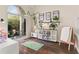 Bright playroom with hardwood floors, a play kitchen, toys, and a large window to the backyard at 4829 Thicket Nw Path, Acworth, GA 30102