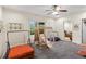 Spacious recreation room with carpet flooring, a ceiling fan, windows, and a variety of recreational equipment at 4829 Thicket Nw Path, Acworth, GA 30102