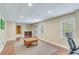 Finished basement with carpet, laminate flooring, recessed lights and neutral walls, offering ample flexible space at 2830 Willow Hill Ct, Cumming, GA 30040