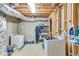 Unfinished basement with laundry area and exposed utilities, offering practical space and potential for customization at 2830 Willow Hill Ct, Cumming, GA 30040