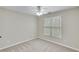 Bright bedroom featuring a window for natural light, neutral walls, carpet, and a calming and inviting space at 2830 Willow Hill Ct, Cumming, GA 30040