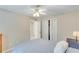Bedroom featuring neutral walls, carpet, ceiling fan, and a closet with bi-fold doors for organized storage at 2830 Willow Hill Ct, Cumming, GA 30040