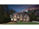 Stunning brick home featuring manicured lawn, tasteful landscaping, and a grand entrance at 2830 Willow Hill Ct, Cumming, GA 30040
