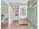 Inviting foyer with hardwood floors, offering a glimpse into the kitchen and living spaces at 2830 Willow Hill Ct, Cumming, GA 30040