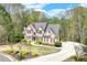 Beautiful brick home with lovely front yard, trimmed bushes, and a circular driveway at 2830 Willow Hill Ct, Cumming, GA 30040