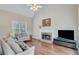 Cozy living room featuring a stone fireplace and high ceilings at 2830 Willow Hill Ct, Cumming, GA 30040