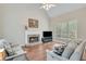 Spacious living room with fireplace and large window for natural light at 2830 Willow Hill Ct, Cumming, GA 30040