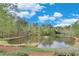 Picturesque pond with lush surroundings and fountain feature, offering scenic views and tranquil ambiance at 2830 Willow Hill Ct, Cumming, GA 30040