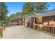 Expansive wooden deck perfect for outdoor entertaining, offering serene views of the surrounding greenery at 2905 Dale Creek Drive Nw, Atlanta, GA 30318