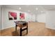 Spacious finished basement with plank flooring, recessed lighting, and ample room for entertainment at 2905 Dale Creek Drive Nw, Atlanta, GA 30318