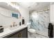 Sleek bathroom with a modern vanity, unique mirror, and glass-enclosed shower with marble tile at 2905 Dale Creek Drive Nw, Atlanta, GA 30318
