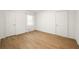 Bedroom featuring wood floors, two closets, and natural light at 2905 Dale Creek Drive Nw, Atlanta, GA 30318