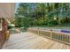 Spacious new wooden deck overlooks the lush backyard, perfect for entertaining at 2905 Dale Creek Drive Nw, Atlanta, GA 30318