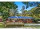 Charming brick home featuring a new wooden deck perfect for outdoor entertaining at 2905 Dale Creek Drive Nw, Atlanta, GA 30318
