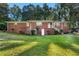 Traditional brick home with a manicured lawn and inviting entrance stairway at 2905 Dale Creek Drive Nw, Atlanta, GA 30318