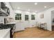 Bright kitchen featuring wood floors, stainless steel appliances, and natural light at 2905 Dale Creek Drive Nw, Atlanta, GA 30318