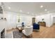 Cozy living room with a fireplace, wood floors, and stylish decor at 2905 Dale Creek Drive Nw, Atlanta, GA 30318