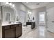 Bathroom with double vanities, granite countertop, tile floors, and a bright and airy feel at 433 Cranleigh Se Rdg, Smyrna, GA 30080