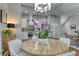 Open-concept living featuring a dining area with round table and an elegant kitchen, seamlessly connecting spaces at 433 Cranleigh Se Rdg, Smyrna, GA 30080