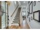Inviting foyer with hardwood floors, staircase, and stylish decor creating a warm and welcoming ambiance at 433 Cranleigh Se Rdg, Smyrna, GA 30080