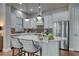 Modern kitchen with white cabinets, stainless steel appliances, and a center island with seating, ready for cooking at 433 Cranleigh Se Rdg, Smyrna, GA 30080