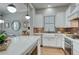 Bright, modern kitchen featuring a large island, white cabinetry, and a stylish subway tile backsplash at 433 Cranleigh Se Rdg, Smyrna, GA 30080
