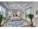 Spacious main bedroom with tray ceiling, barn door to bathroom, and ample natural light creates a tranquil retreat at 433 Cranleigh Se Rdg, Smyrna, GA 30080