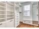 Walk-in closet with custom shelving and drawers, providing ample storage space at 433 Cranleigh Se Rdg, Smyrna, GA 30080