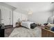 Cozy bedroom with neutral tones, carpet, a decorative light fixture, and stylish furniture at 7500 Gillespie Pl, Douglasville, GA 30135