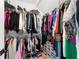 Organized closet with shelving and hanging space, showcasing ample storage for clothing and accessories at 7500 Gillespie Pl, Douglasville, GA 30135