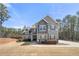 Charming two-story home boasts a gray exterior, accented by dark shutters and a well-manicured lawn at 7500 Gillespie Pl, Douglasville, GA 30135