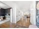 Open hallway showcasing hardwood floors and views of the office and living room at 7500 Gillespie Pl, Douglasville, GA 30135