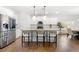 Modern kitchen with stainless steel appliances, white cabinetry, and a center island with seating at 7500 Gillespie Pl, Douglasville, GA 30135