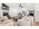 Inviting living room featuring a stone fireplace, neutral furniture, and hardwood floors at 7500 Gillespie Pl, Douglasville, GA 30135