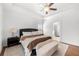 Bright main bedroom featuring a ceiling fan, and ample natural light at 7500 Gillespie Pl, Douglasville, GA 30135