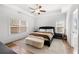 Relaxing main bedroom featuring a tray ceiling, and ample natural light at 7500 Gillespie Pl, Douglasville, GA 30135