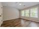 Bright bedroom with vaulted ceiling, ceiling fan, and luxury vinyl plank flooring at 9155 Nesbit Ferry Rd # 65, Alpharetta, GA 30022