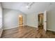 Bedroom featuring vaulted ceiling, LVP flooring and doorway to en suite bathroom at 9155 Nesbit Ferry Rd # 65, Alpharetta, GA 30022