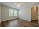 Bright bedroom with vaulted ceiling, ceiling fan, and luxury vinyl plank flooring at 9155 Nesbit Ferry Rd # 65, Alpharetta, GA 30022
