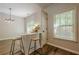 Open concept dining area filled with natural light features stylish breakfast bar with seating for two at 9155 Nesbit Ferry Rd # 65, Alpharetta, GA 30022